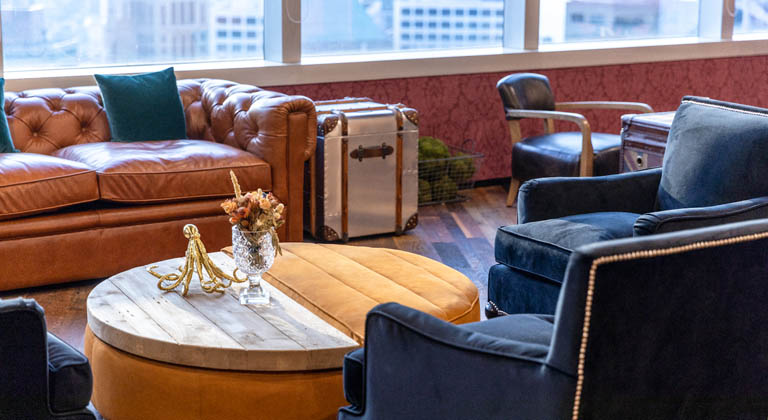 ​​Open Coworking Space with stylish desks, cozy seating areas, and vibrant decor at 3 Garden Road in Hong Kong