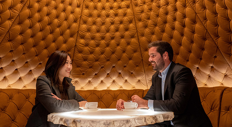 Business professionals collaborating in the iconic Apollo Capsule by Timothy Oulton Studios at TEC Centres, AIA Central