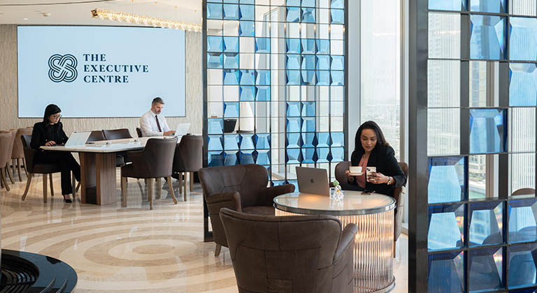 A vibrant coworking area in KAFD 3.09 Centre of TEC in Riyadh, showcasing open seating with ergonomic chairs, modern desks, warm lighting, and collaborative spaces designed for productivity, complemented by stylish decor and a professional ambience